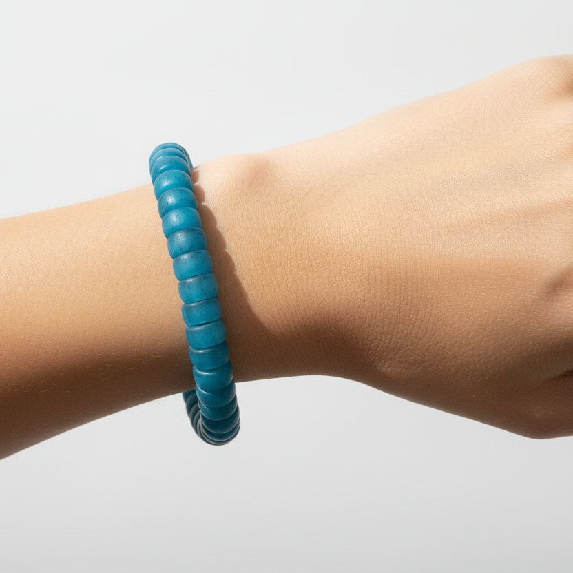 Matte teal rondelle resin bead bracelet on wrist