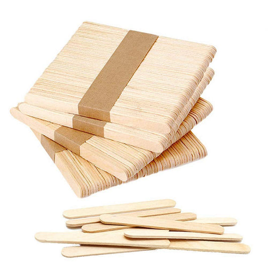 Loose light tan wooden craft sticks for DIY projects, assorted lengths