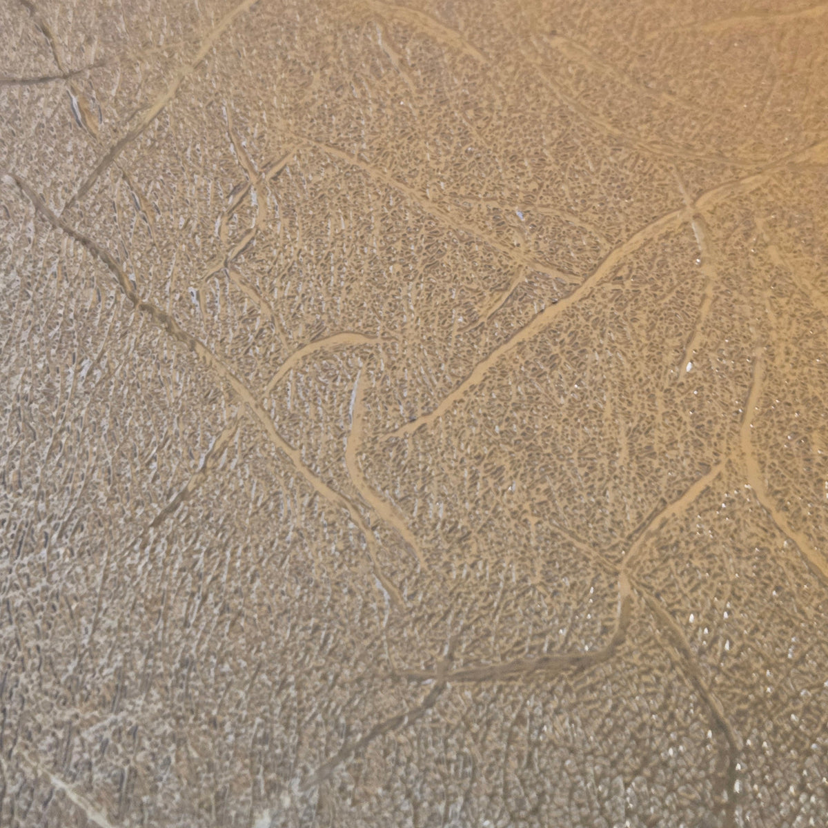 Copper textured metallic permanent vinyl sheet, 12x12 in, close-up texture.