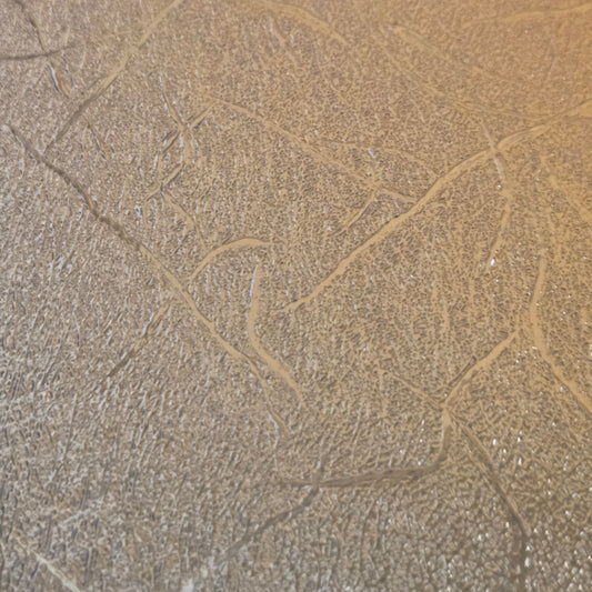 Copper textured metallic permanent vinyl sheet, 12x12 in, close-up texture.