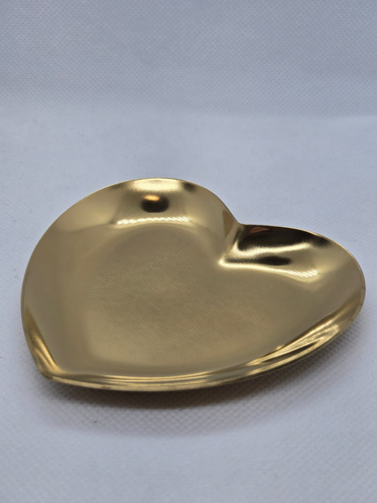 Gold heart-shaped plate with glossy reflective finish