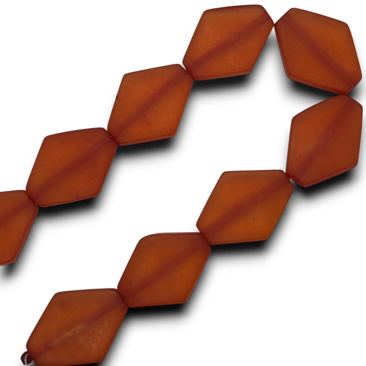 Orange flat diamond resin bead strand, curved row of faceted beads