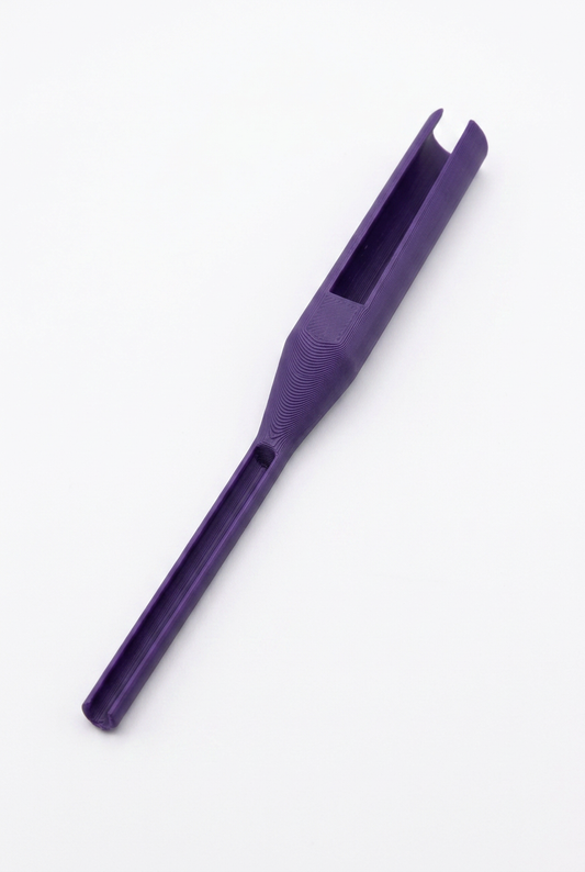 Purple 3D printed knotter tool for jewelry and macrame, with a slot end.