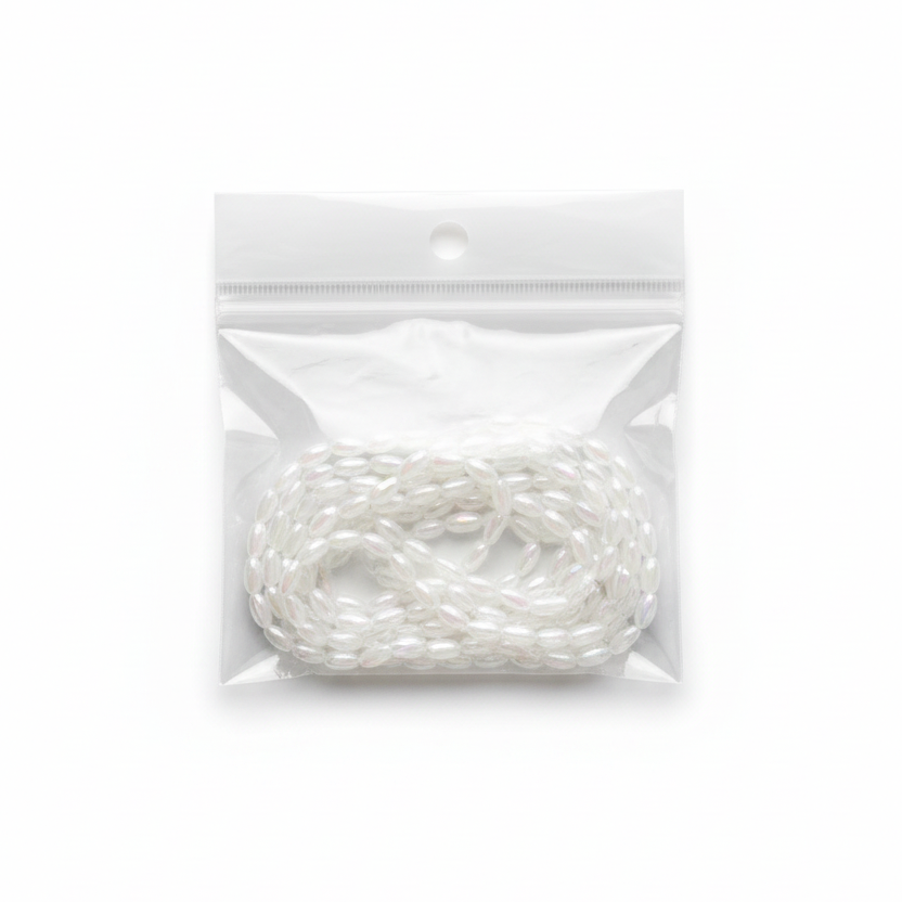 White Iridescent Oval Beads Strand – Studio Photo