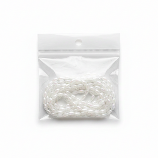 White Iridescent Oval Beads Strand – Studio Photo